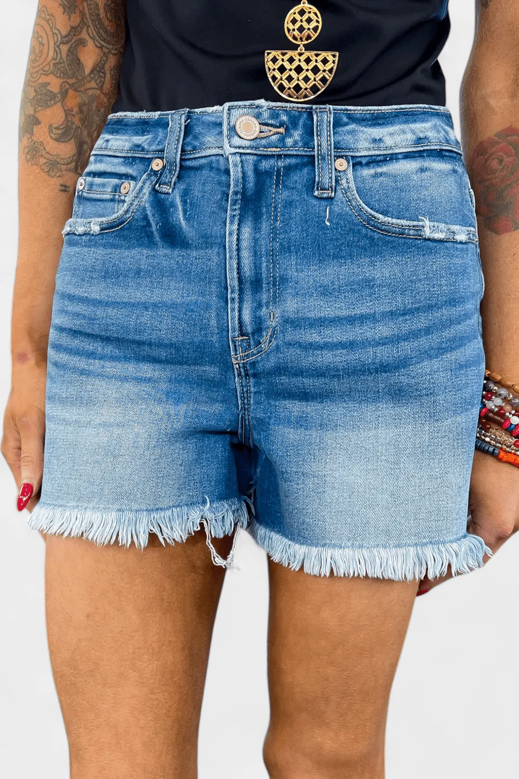 Medium Wash Mid Rise Raw Hem Denim Shorts